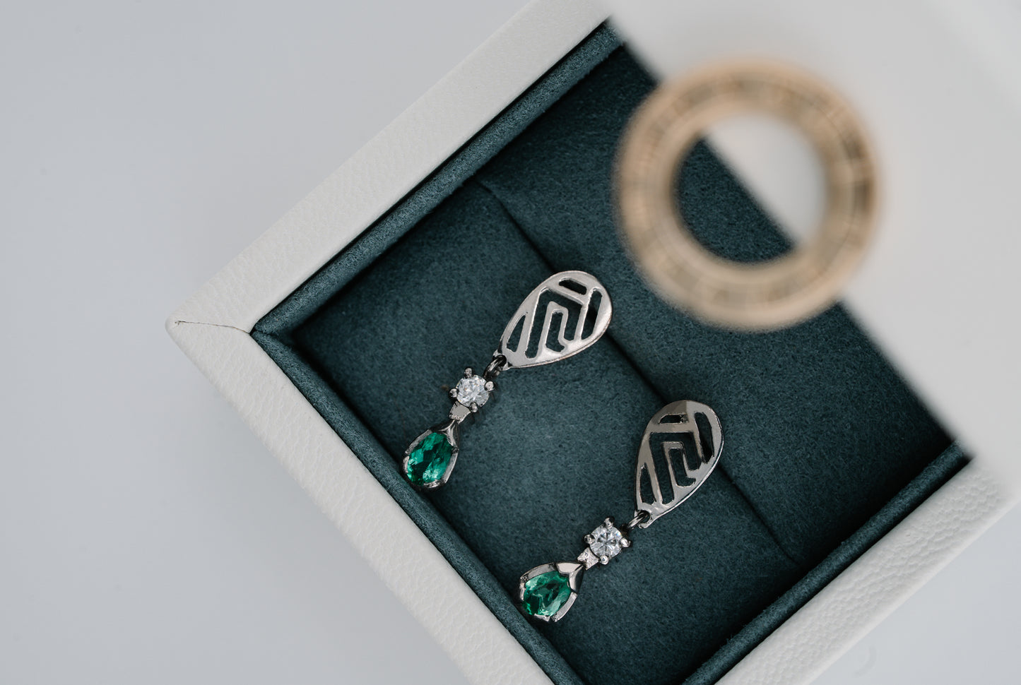 The Whisper of the Eagle Colombian Emerald Earrings in 0.42 ct Sterling Silver
