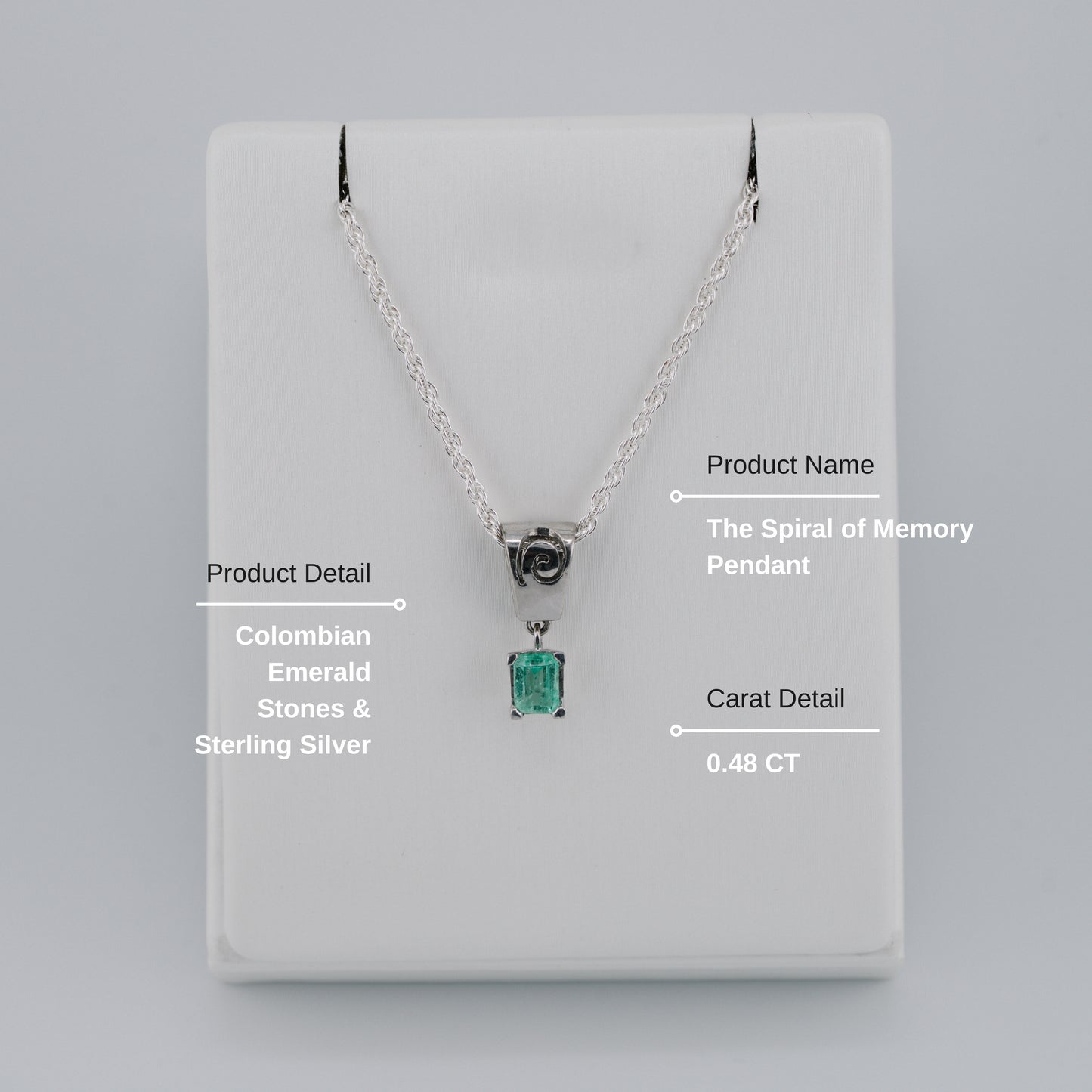 The Spiral of Memory Pendant – 0.48 Colombian Emerald – 950 Sterling Silver