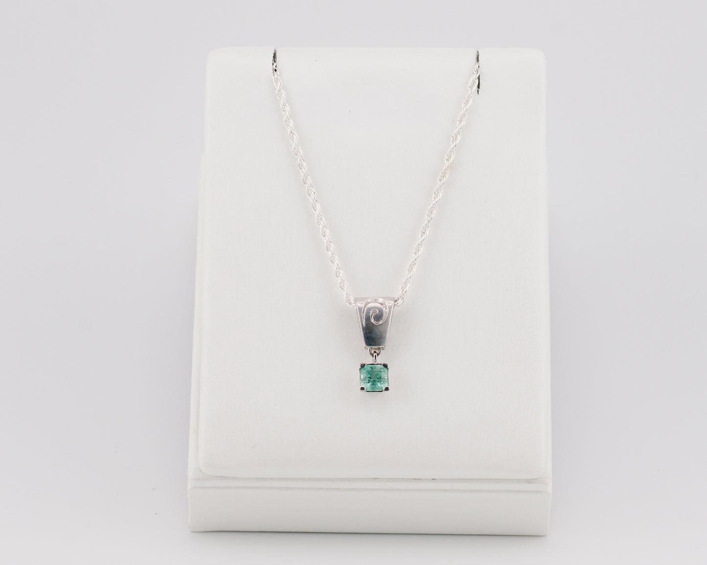 The Spiral of Memory Pendant – 0.61 Colombian Emerald – 950 Sterling Silver