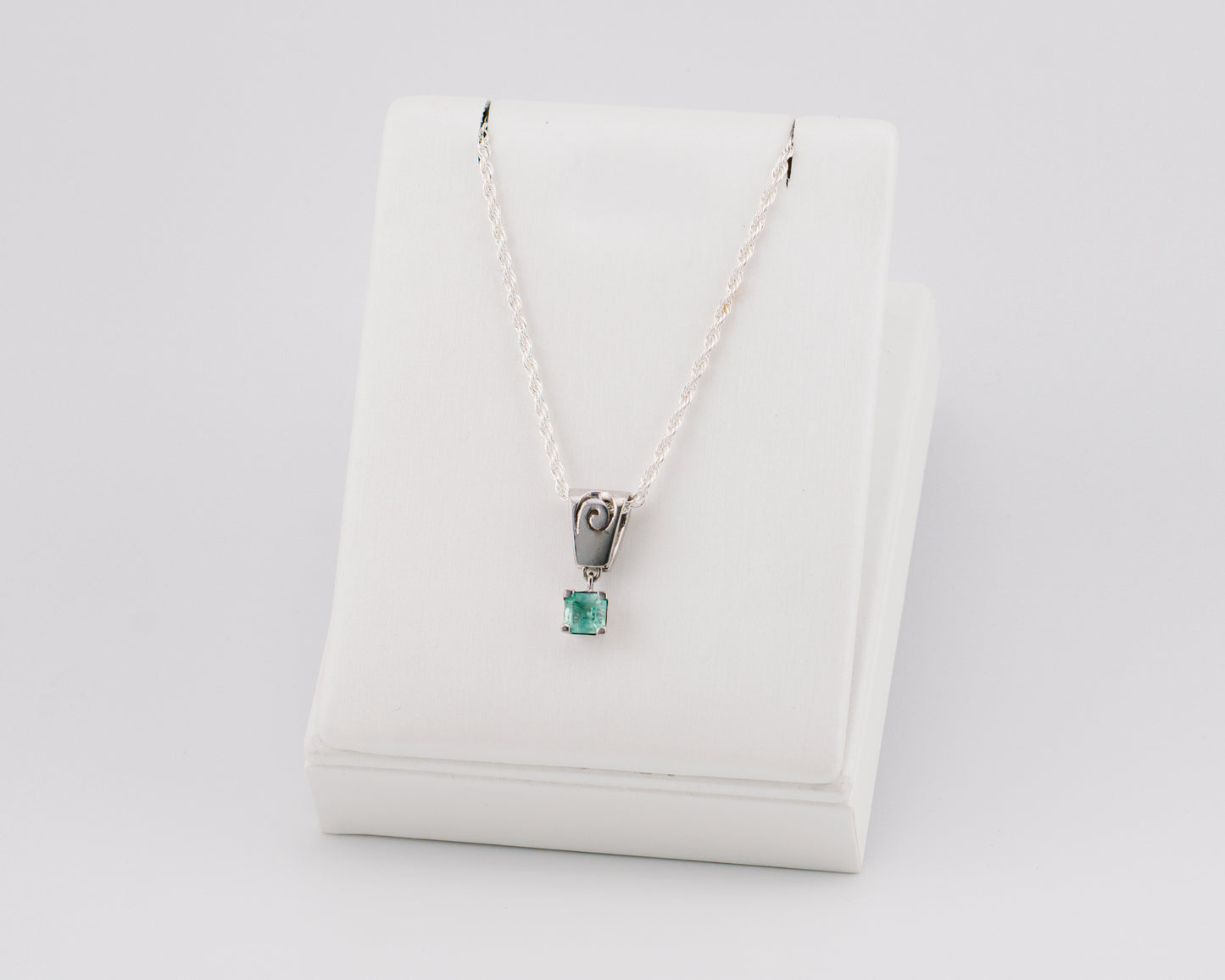 The Spiral of Memory Pendant – 0.61 Colombian Emerald – 950 Sterling Silver