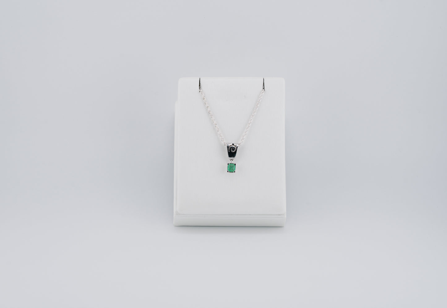 The Spiral of Memory Pendant – 0.74 Colombian Emerald – 950 Sterling Silver