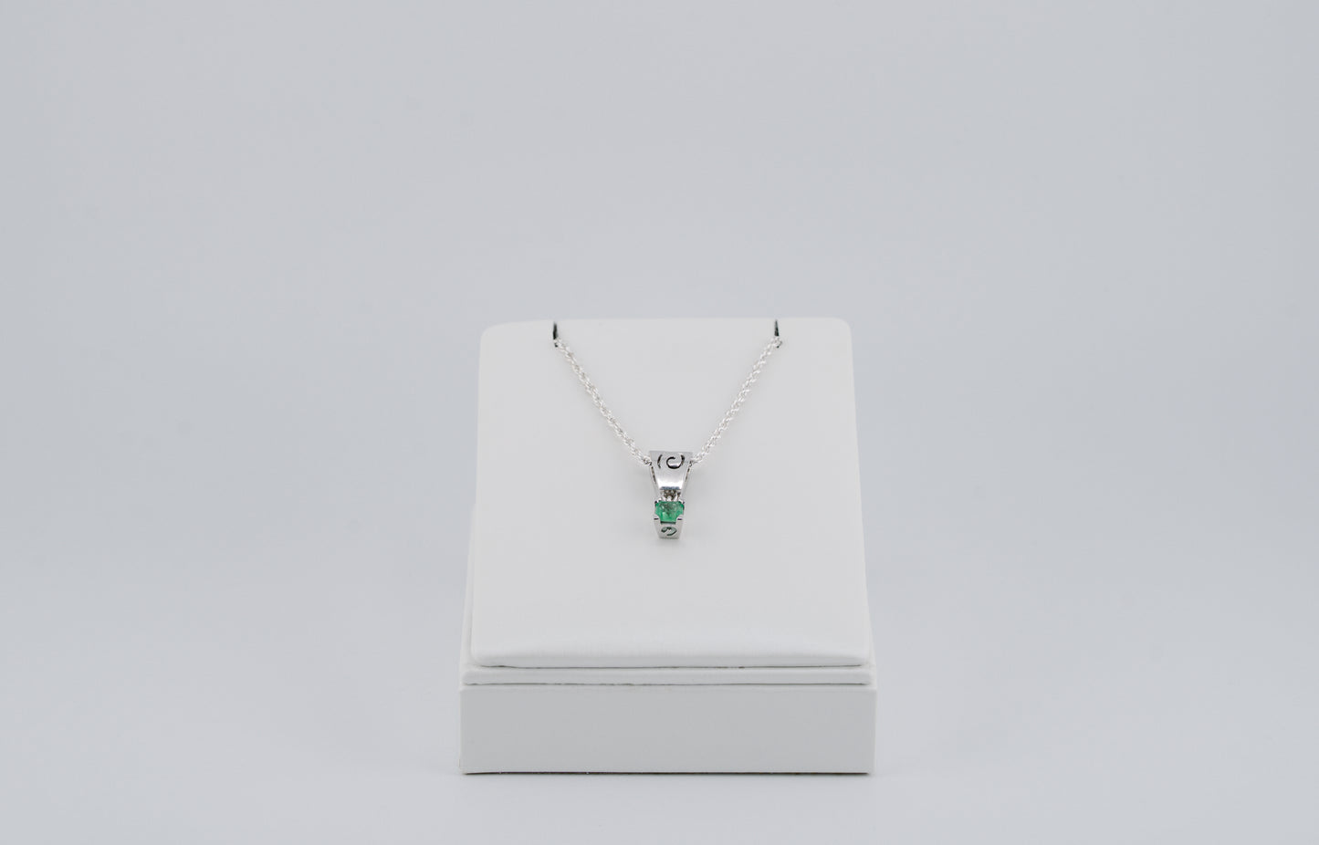 The Spiral of Memory Pendant – 0.74 Colombian Emerald – 950 Sterling Silver