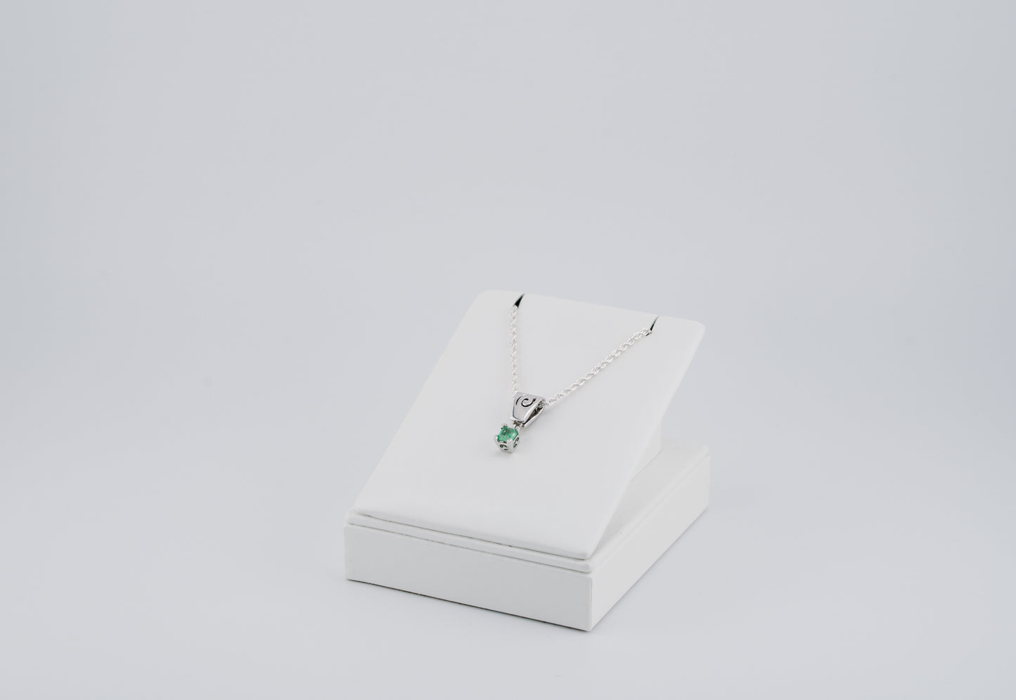 The Spiral of Memory Pendant – 0.74 Colombian Emerald – 950 Sterling Silver