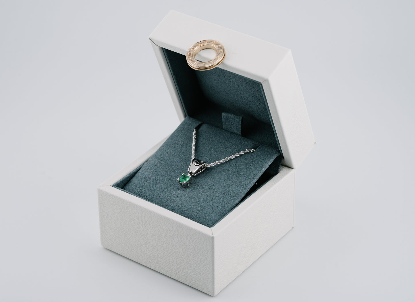 The Spiral of Memory Pendant – 0.74 Colombian Emerald – 950 Sterling Silver