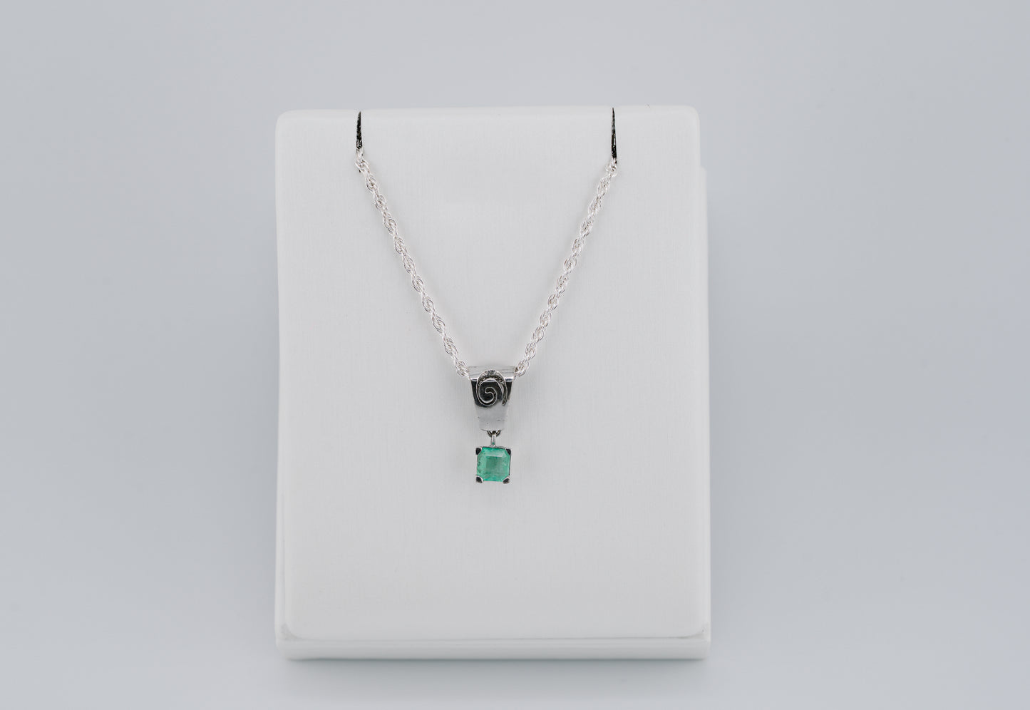 The Spiral of Memory Pendant – 0.75 Colombian Emerald – 950 Sterling Silver