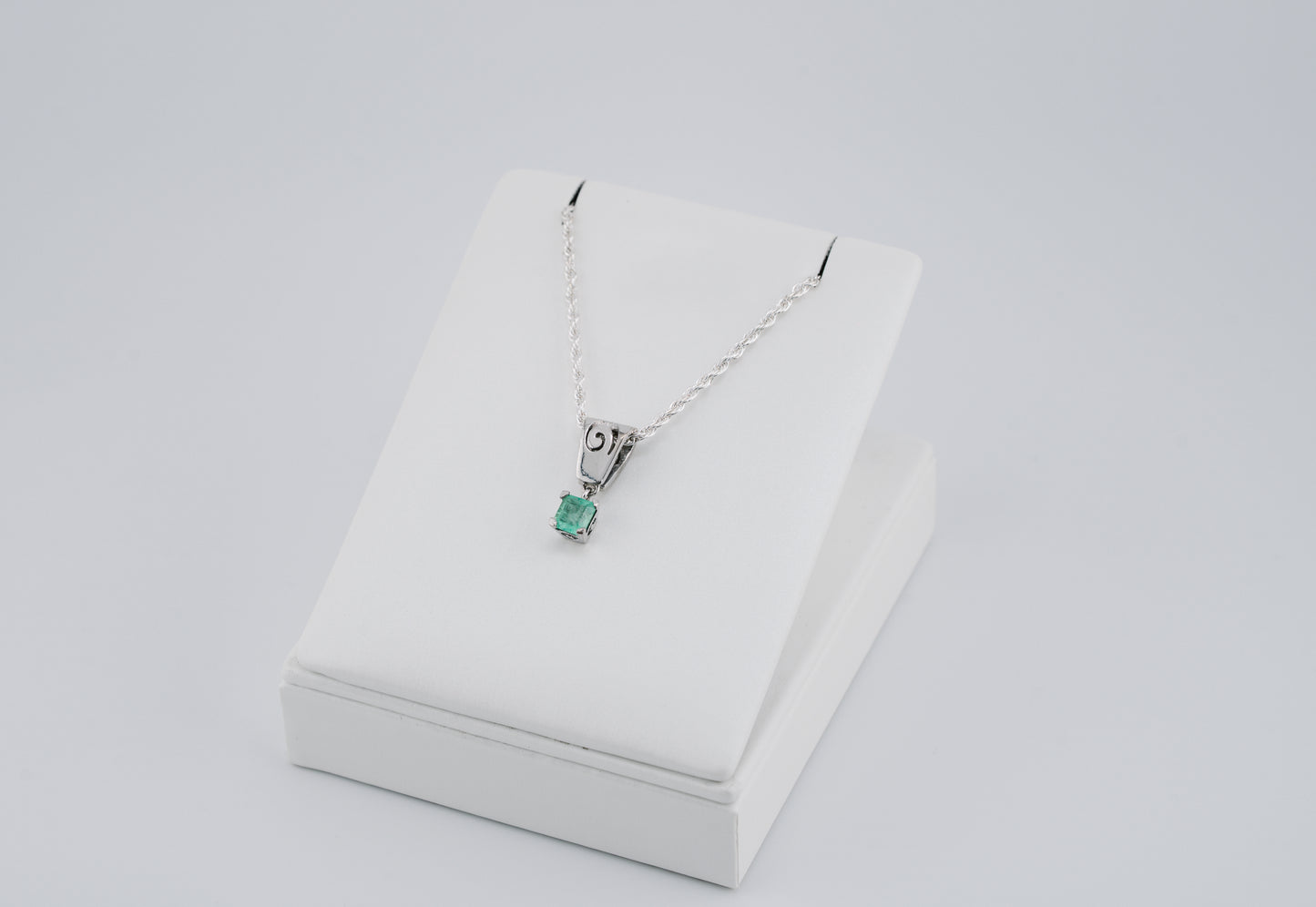 The Spiral of Memory Pendant – 0.75 Colombian Emerald – 950 Sterling Silver