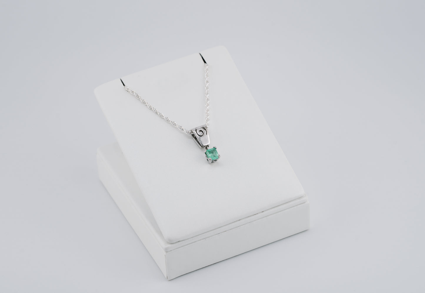 The Spiral of Memory Pendant – 0.75 Colombian Emerald – 950 Sterling Silver