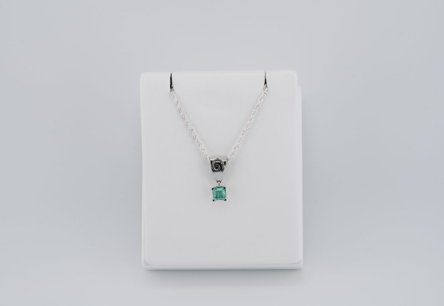 The Spiral of Memory Pendant – 0.73 Colombian Emerald – 950 Sterling Silver