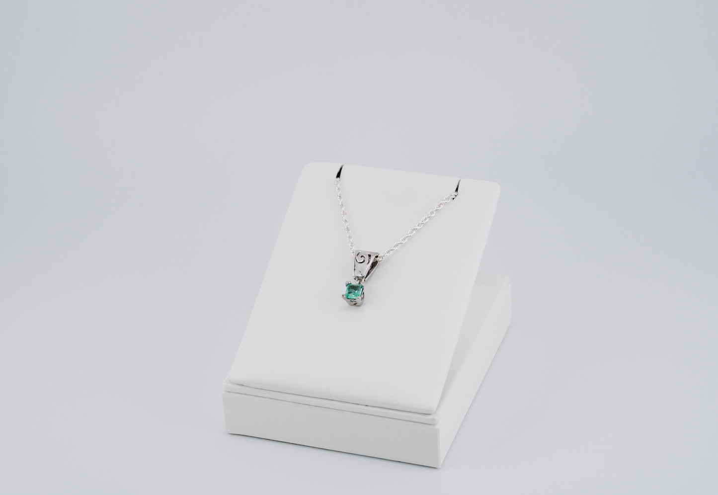 The Spiral of Memory Pendant – 0.73 Colombian Emerald – 950 Sterling Silver