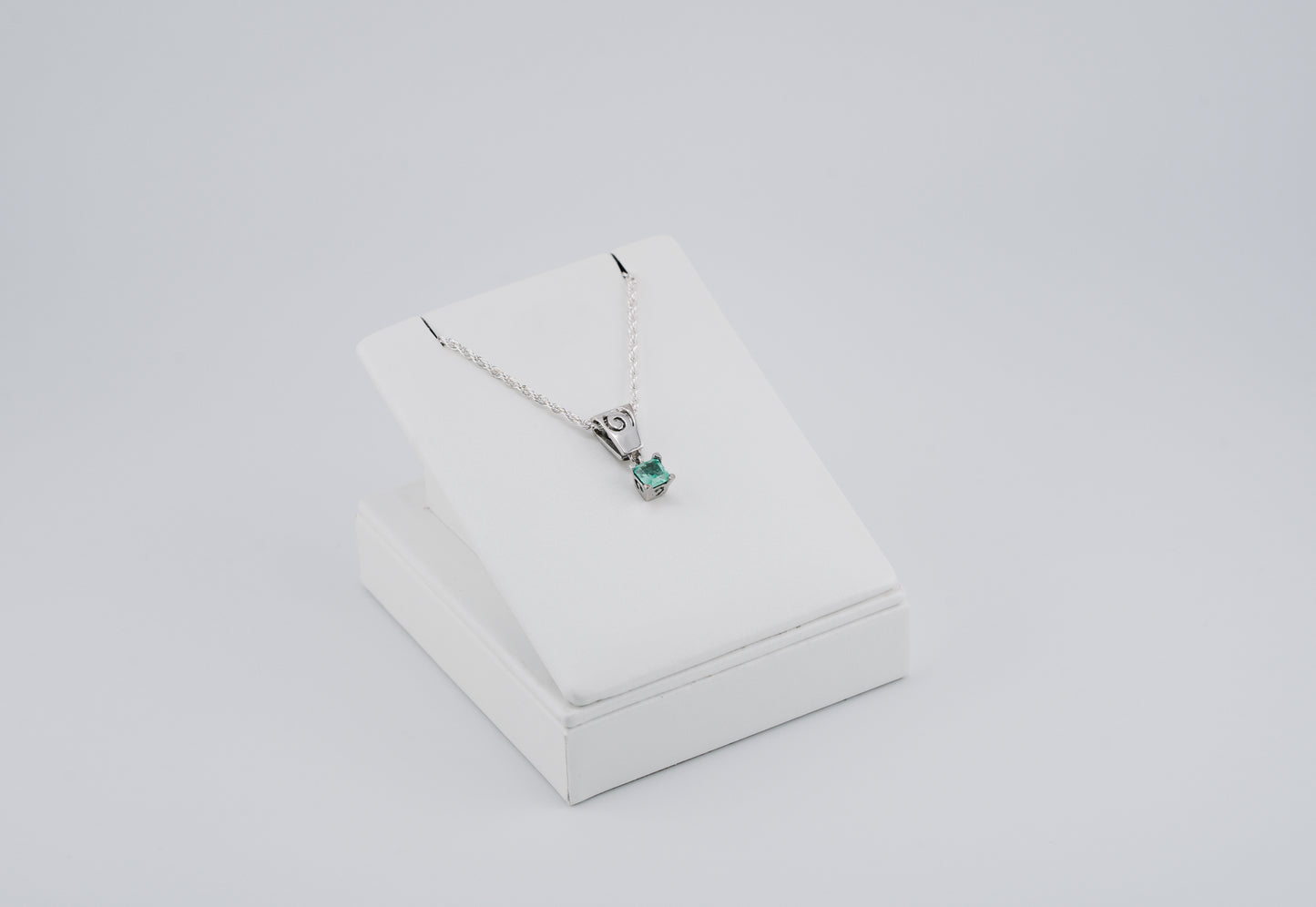 The Spiral of Memory Pendant – 0.73 Colombian Emerald – 950 Sterling Silver