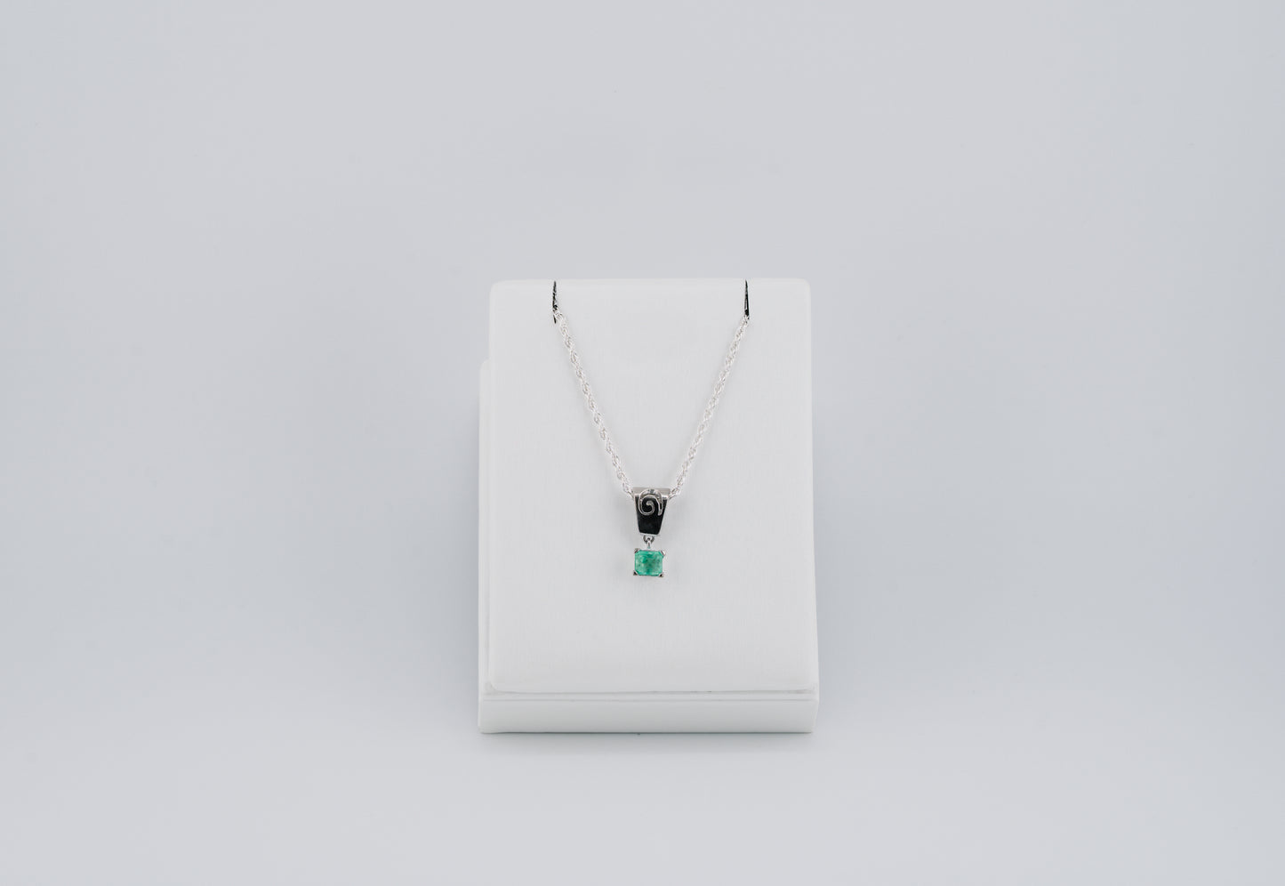 The Spiral of Memory Pendant – 0.55 Colombian Emerald – 950 Sterling Silver
