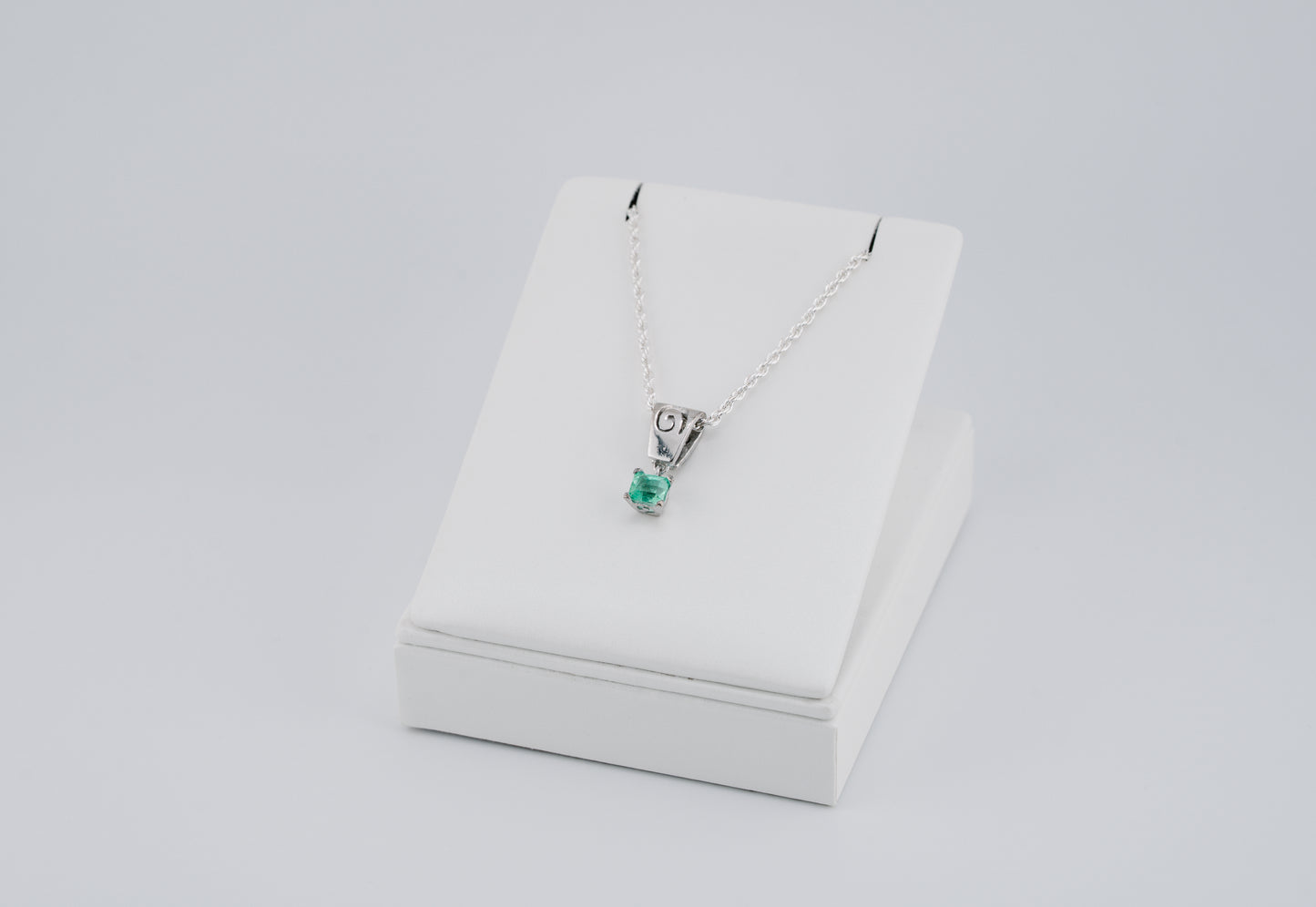 The Spiral of Memory Pendant – 0.55 Colombian Emerald – 950 Sterling Silver