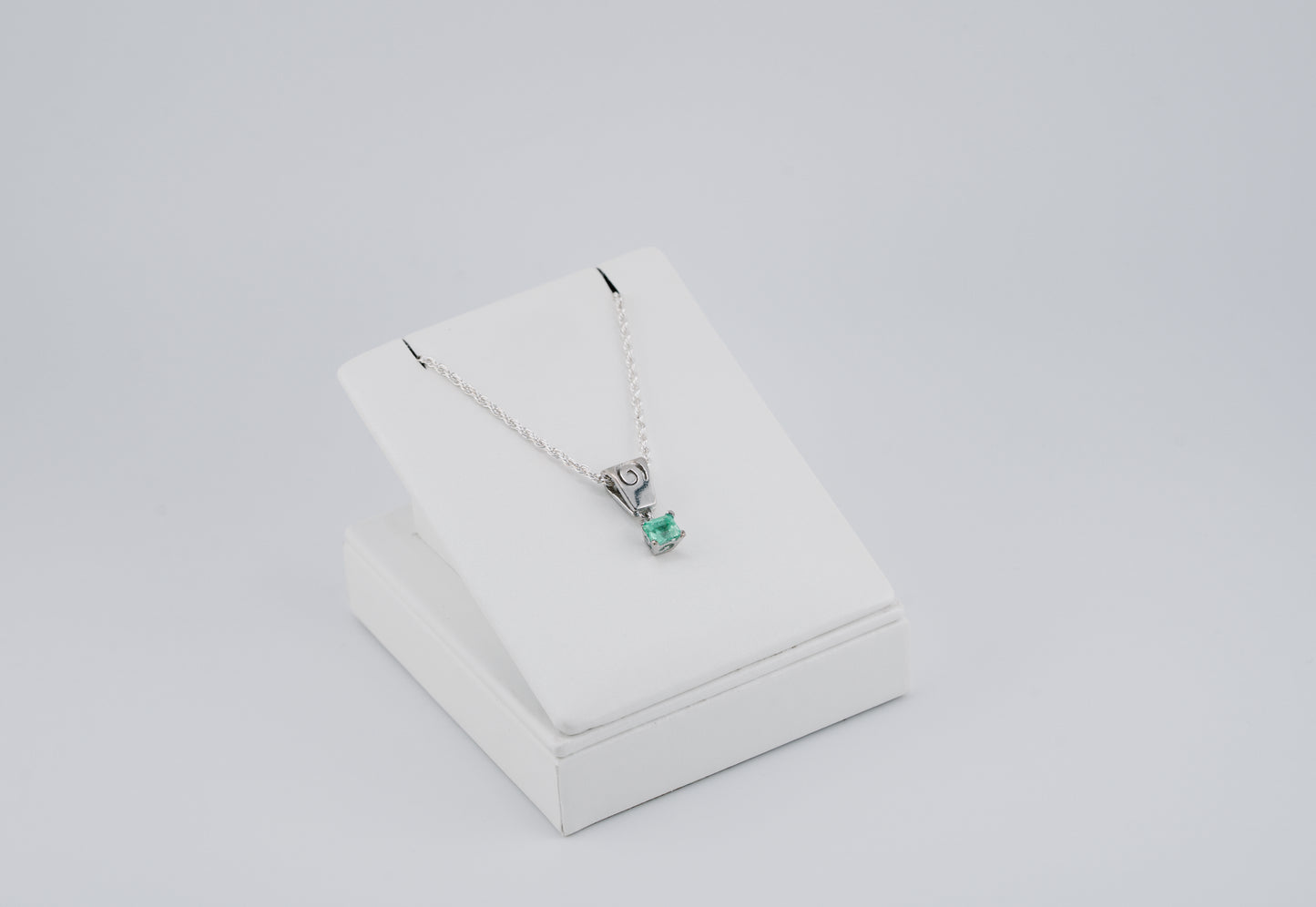 The Spiral of Memory Pendant – 0.55 Colombian Emerald – 950 Sterling Silver