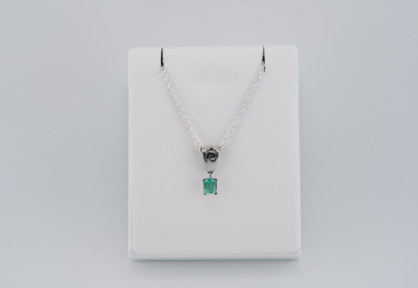 The Spiral of Memory Pendant – 0.48 Colombian Emerald – 950 Sterling Silver