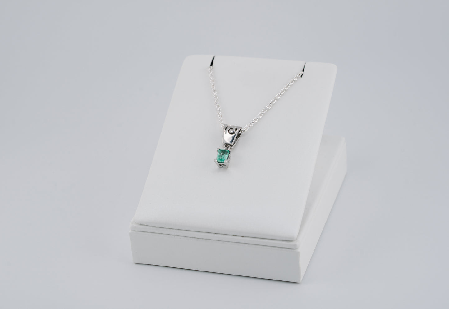The Spiral of Memory Pendant – 0.48 Colombian Emerald – 950 Sterling Silver