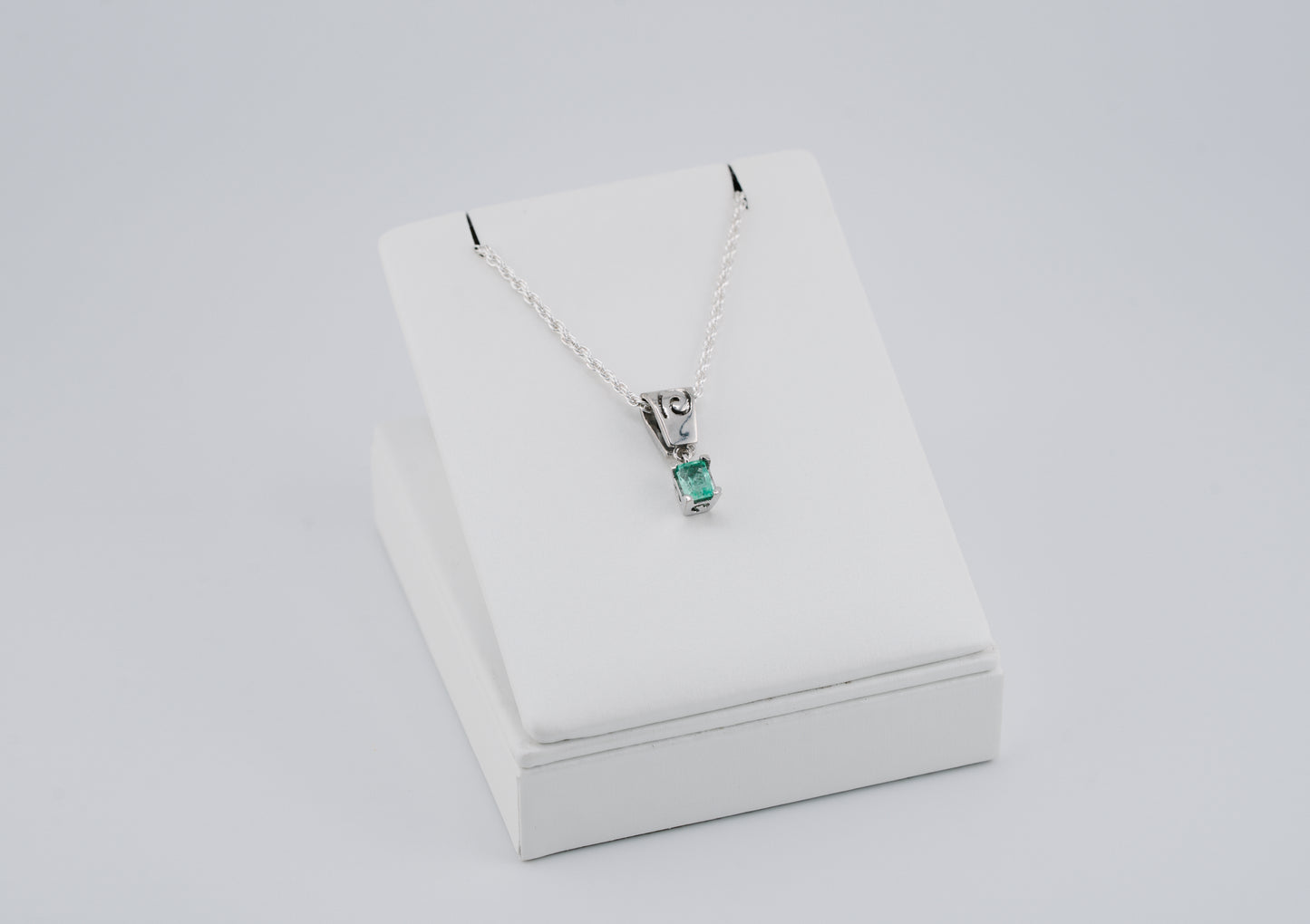 The Spiral of Memory Pendant – 0.48 Colombian Emerald – 950 Sterling Silver
