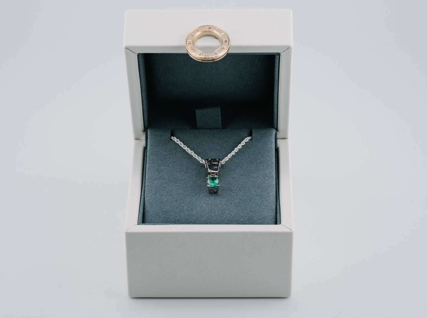 The Spiral of Memory Pendant – 0.48 Colombian Emerald – 950 Sterling Silver