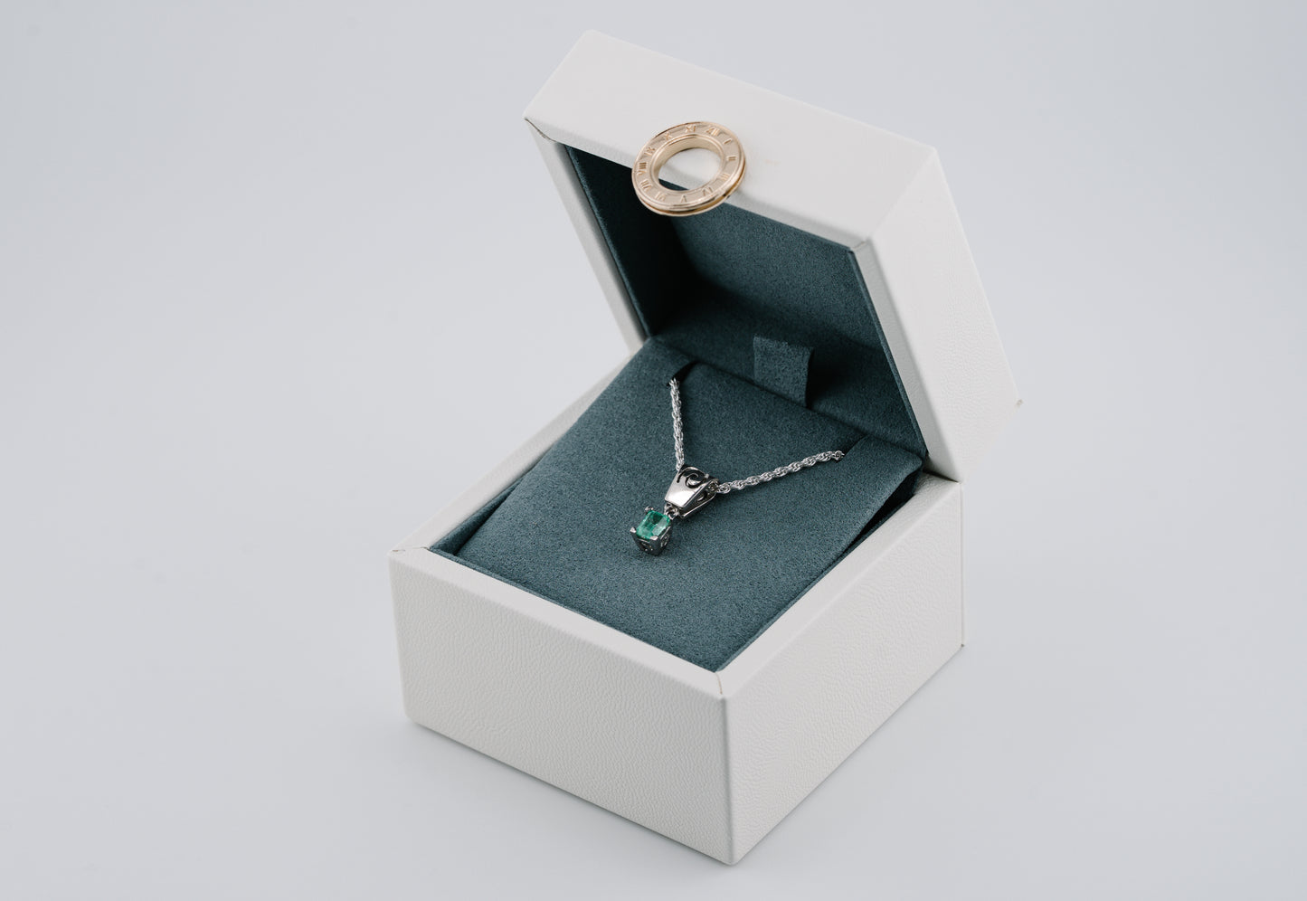 The Spiral of Memory Pendant – 0.48 Colombian Emerald – 950 Sterling Silver