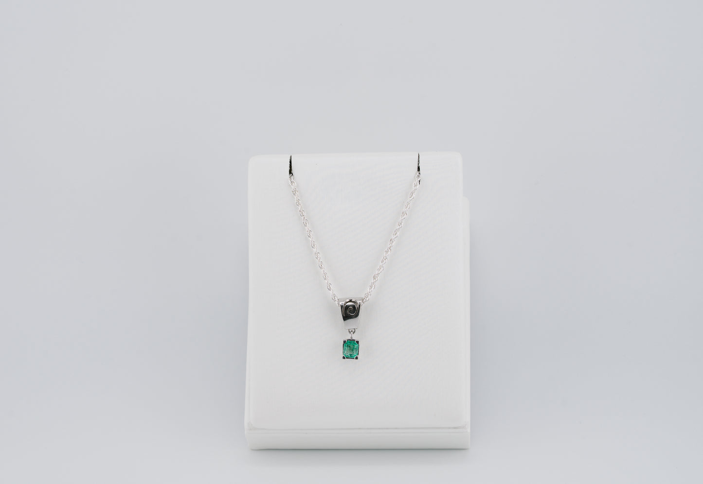 The Spiral of Memory Pendant – 0.47 Colombian Emerald – 950 Sterling Silver