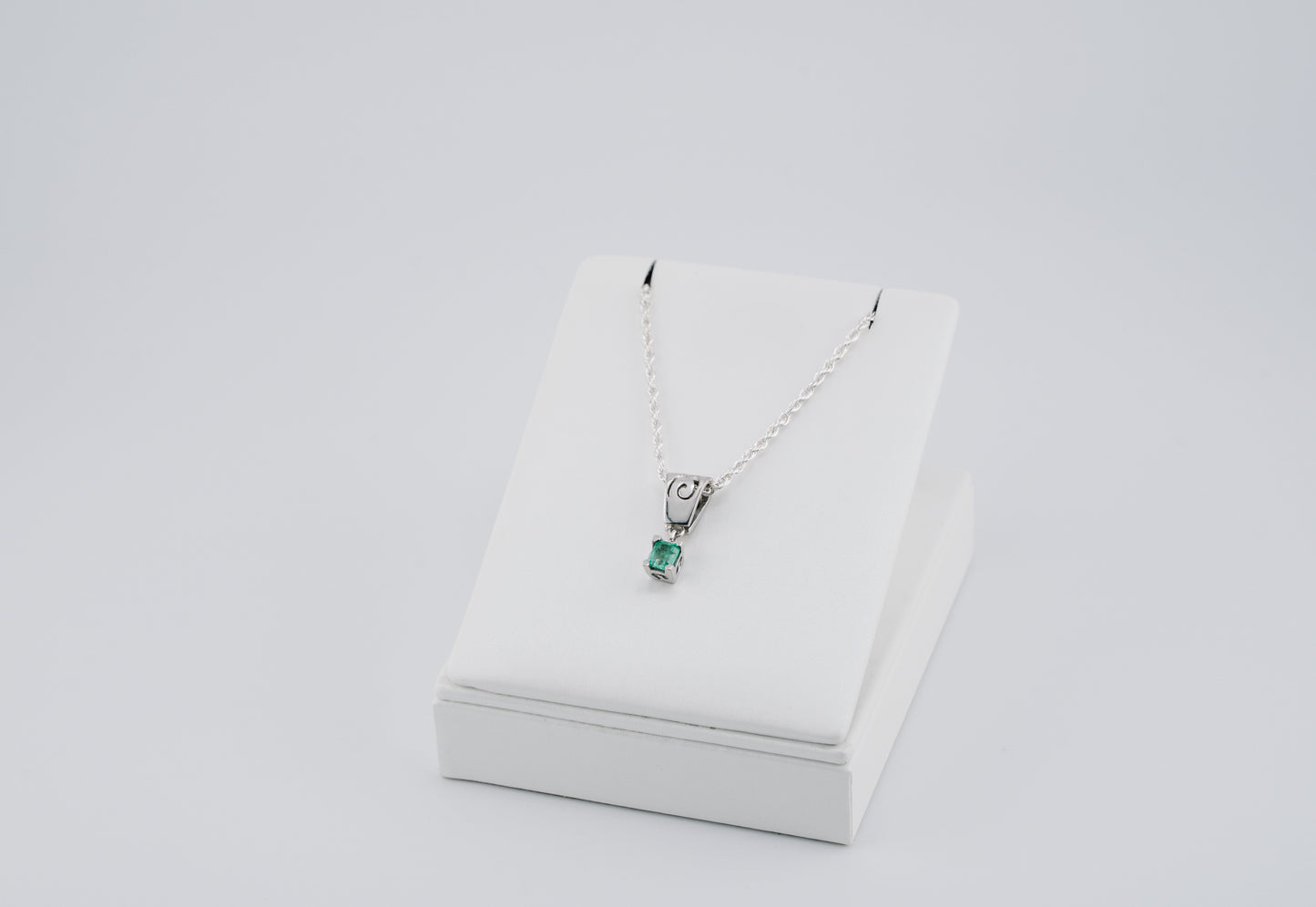 The Spiral of Memory Pendant – 0.47 Colombian Emerald – 950 Sterling Silver