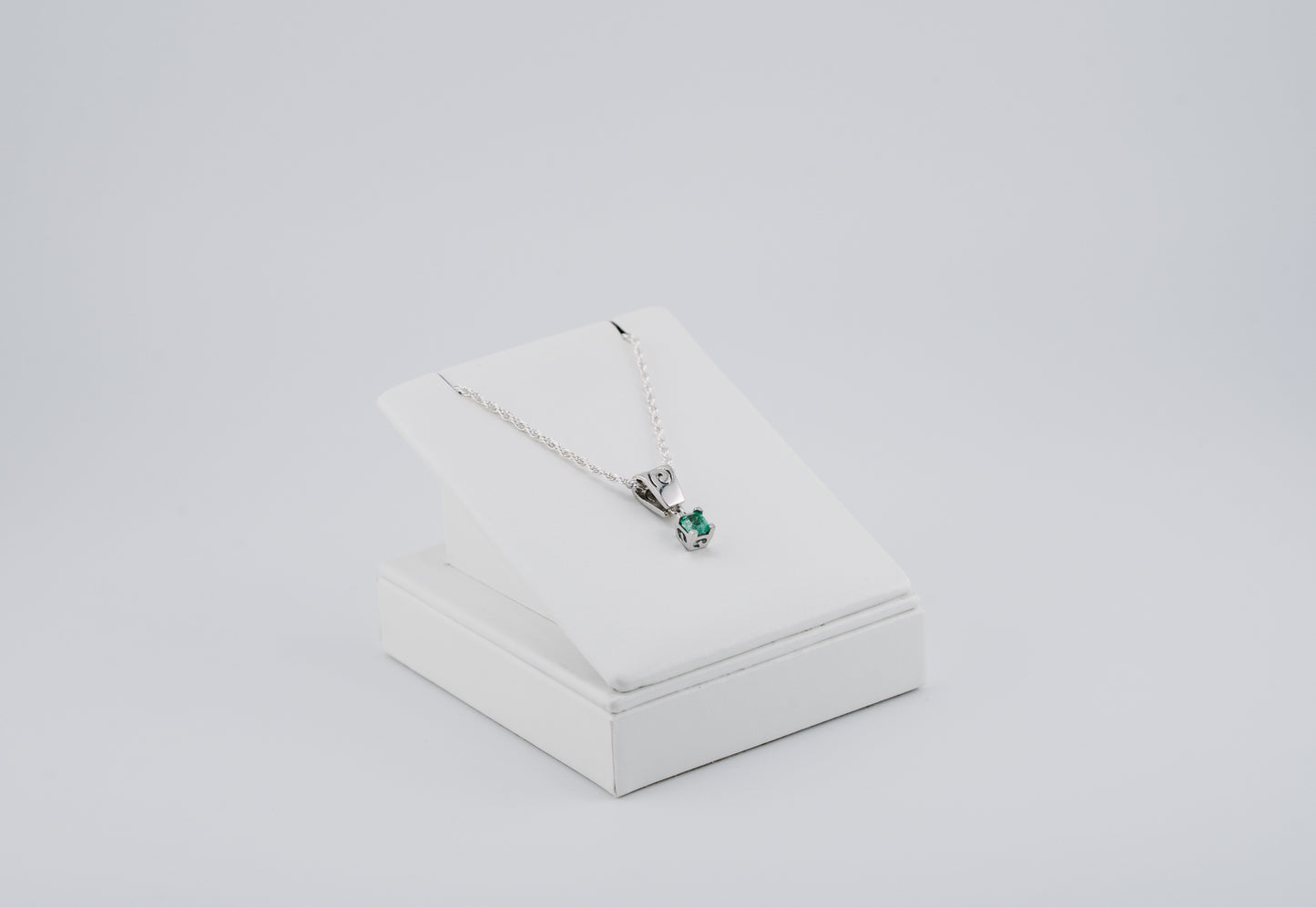 The Spiral of Memory Pendant – 0.47 Colombian Emerald – 950 Sterling Silver