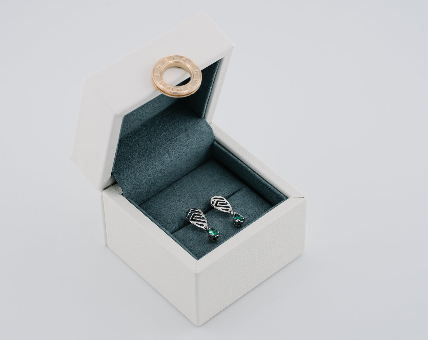 The Whisper of the Eagle Colombian Emerald Earrings in 0.27 ct Sterling Silver