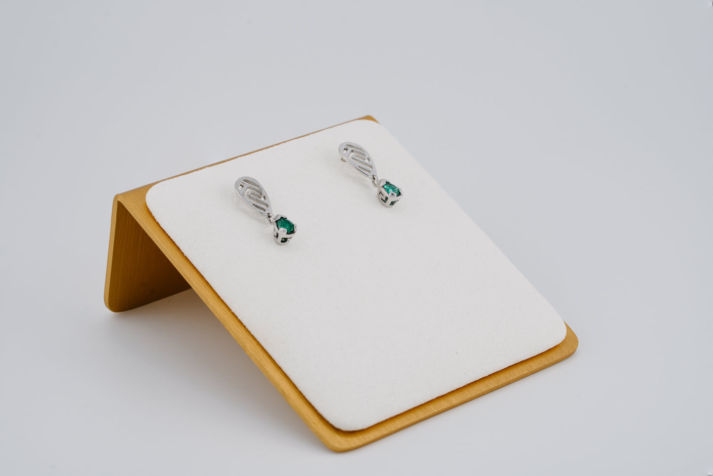 The Whisper of the Eagle Colombian Emerald Earrings in 0.29 ct Sterling Silver