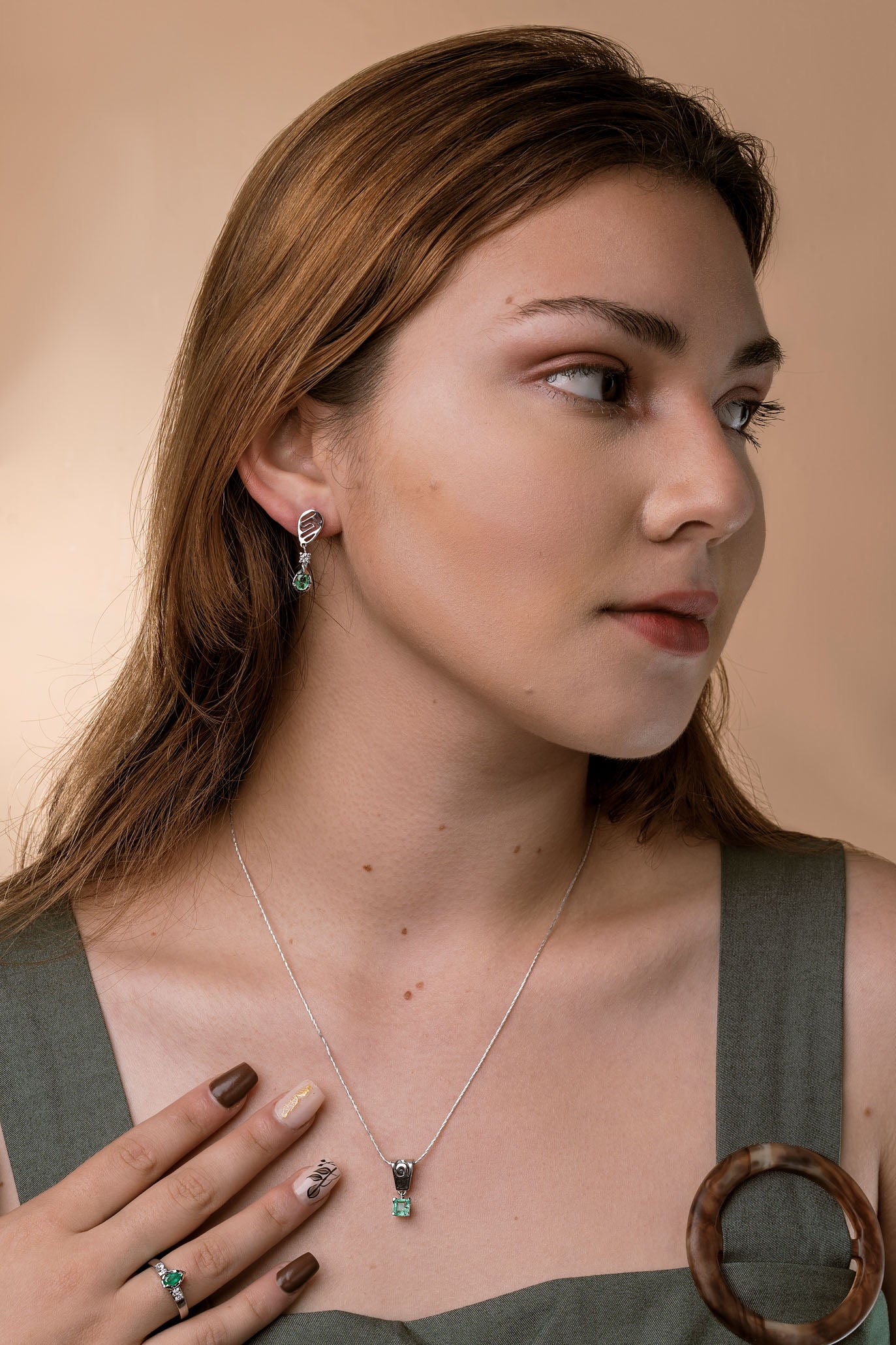 The Whisper of the Eagle Colombian Emerald Earrings in 0.27 ct Sterling Silver